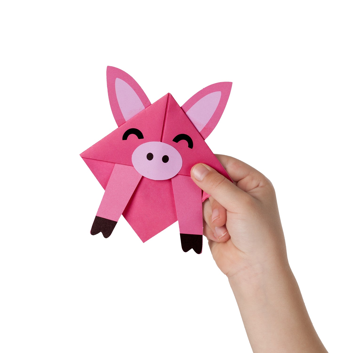 Pink origami animal bookmark held by a child