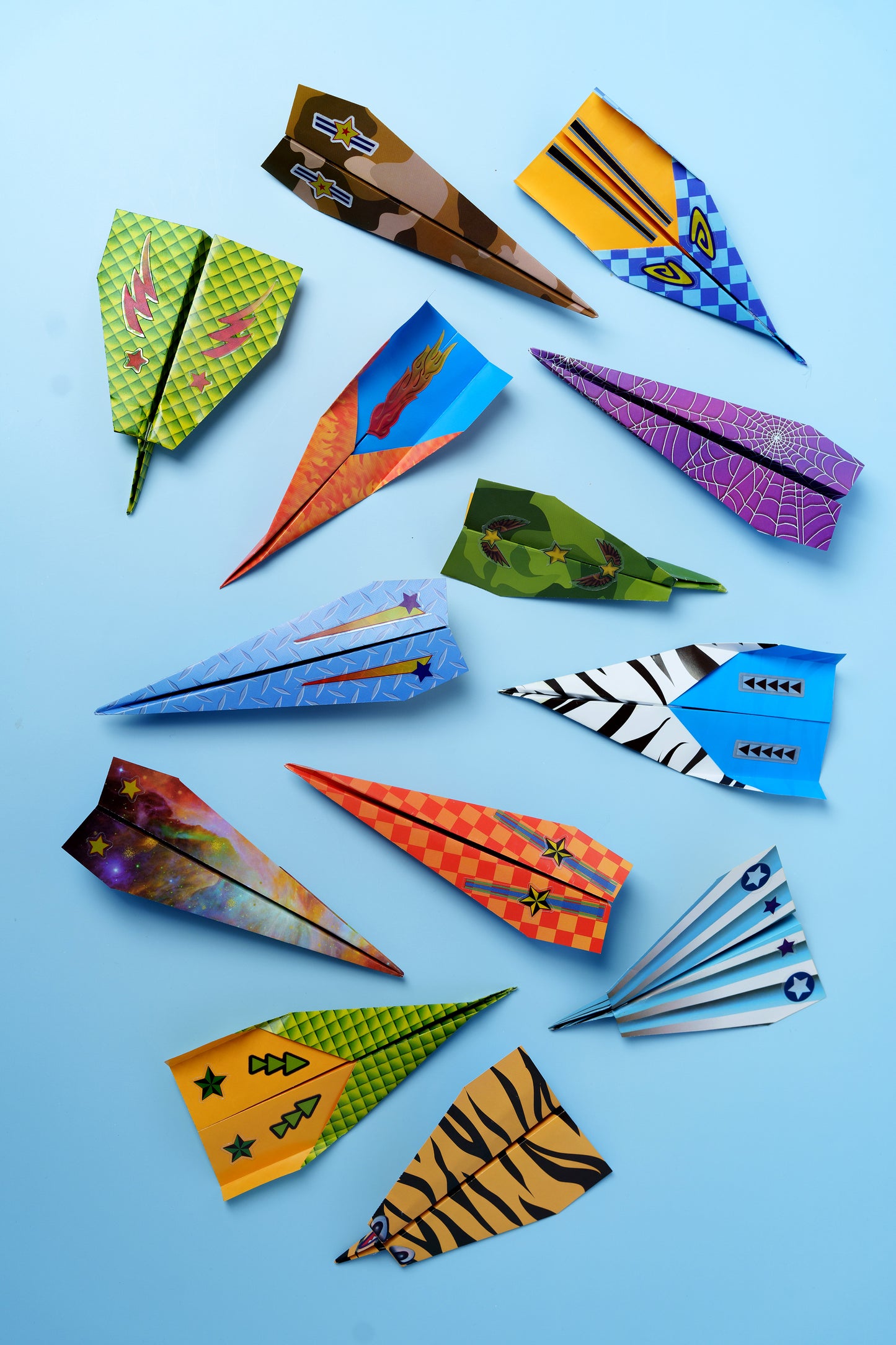 Different paper airplane designs created with the Paper Airplane Squadron kit