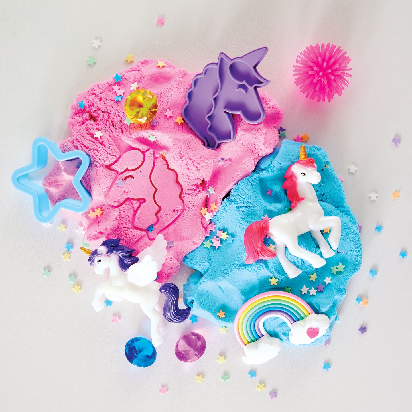 Unicorns, rainbow and colourful cloud clay arranged for magical sensory play