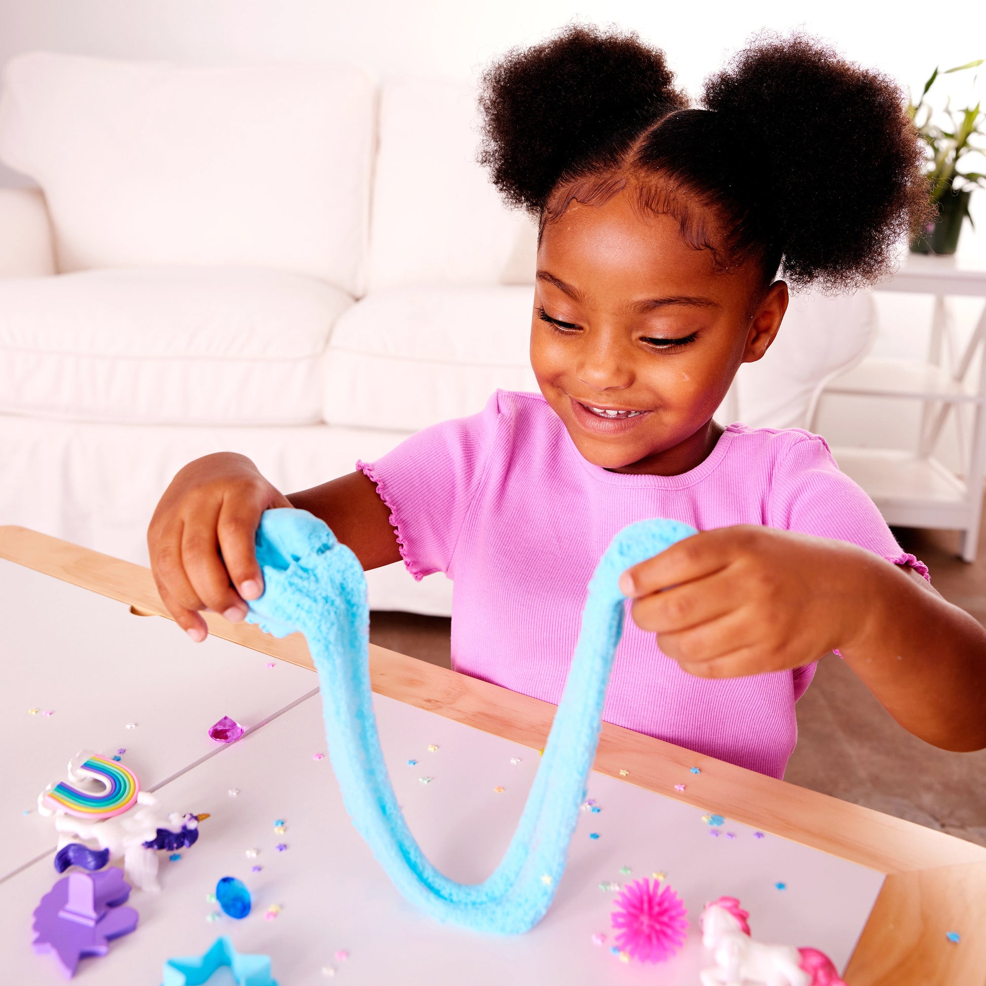 Child enjoying hands-on Unicorn Sensory Pack play